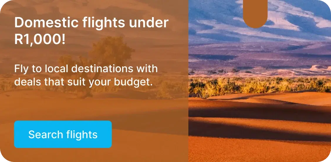 A promotional banner reading Domestic flights under R1,000, with a Search flights button beside a photograph of desert dunes.